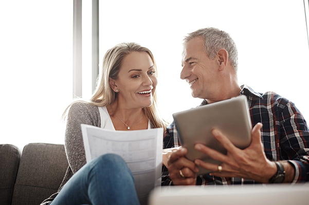 How to become a customer. Man and woman in sofa with laptop. Photo